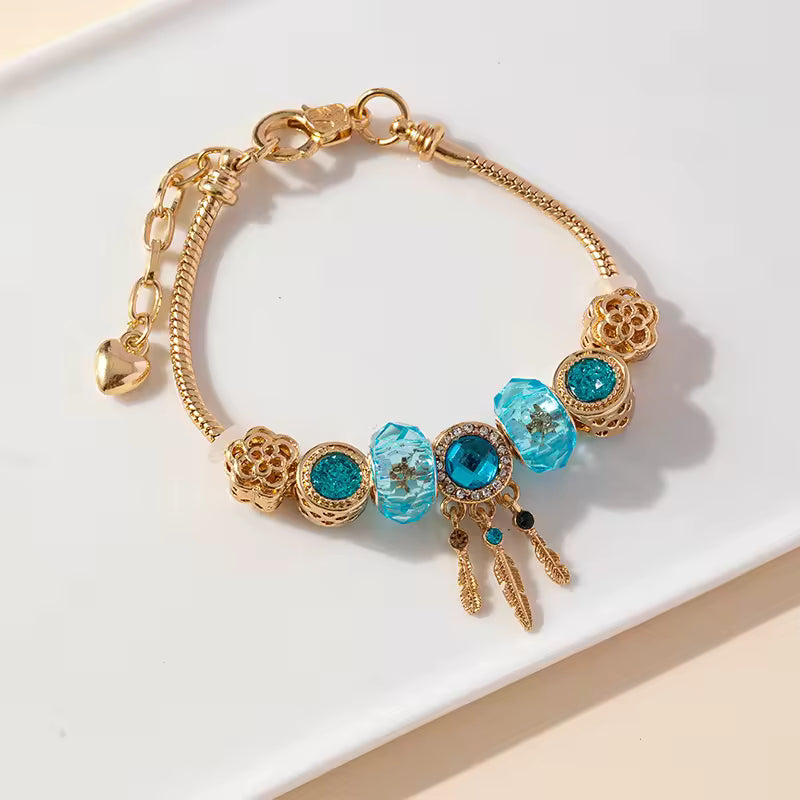 Aestify™ Aqua Dream Charm Bracelet – 18K Gold Tone | Premium CZ + Crystal Charms