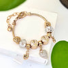 Aestify™ Golden Bloom Charm Bracelet – 18K Gold Tone | Crystal CZ Beads