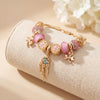 Aestify™ Dreamcatcher Pink Gold Charm Bracelet – 18K Gold Tone | Crystal & CZ Beads